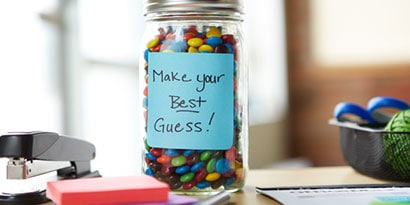 Gather a number of the same type of item like coins, marbles, pebbles or peas and place them in a clear jar.