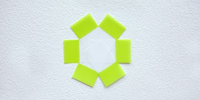 Place six Post-it® Flags in a circle on a flat surface, sticky side down, with the sticky ends toward the center, and the colored ends